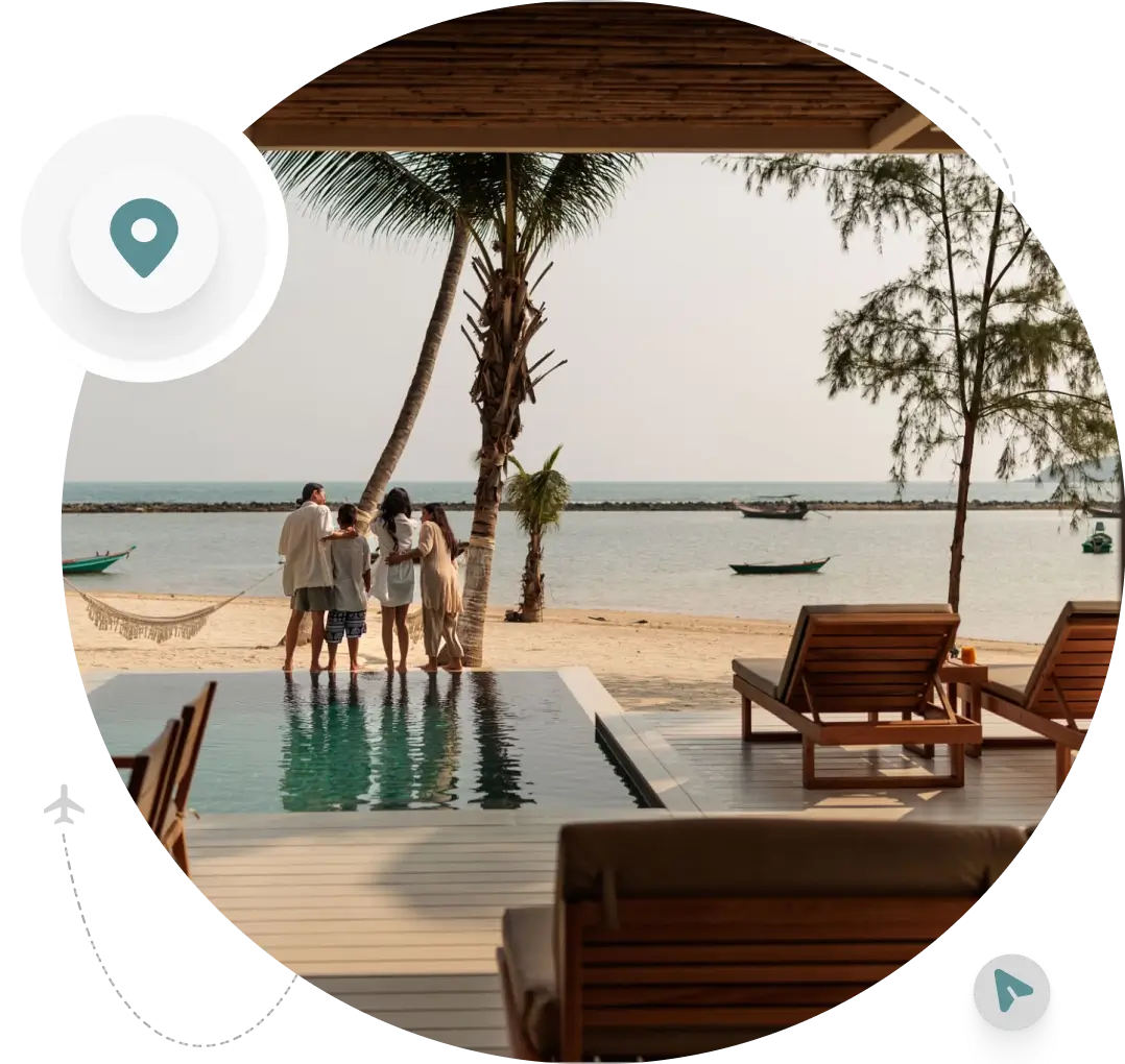 Beachfront pool with people and palm trees