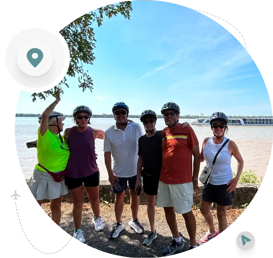 Group of cyclists by a river