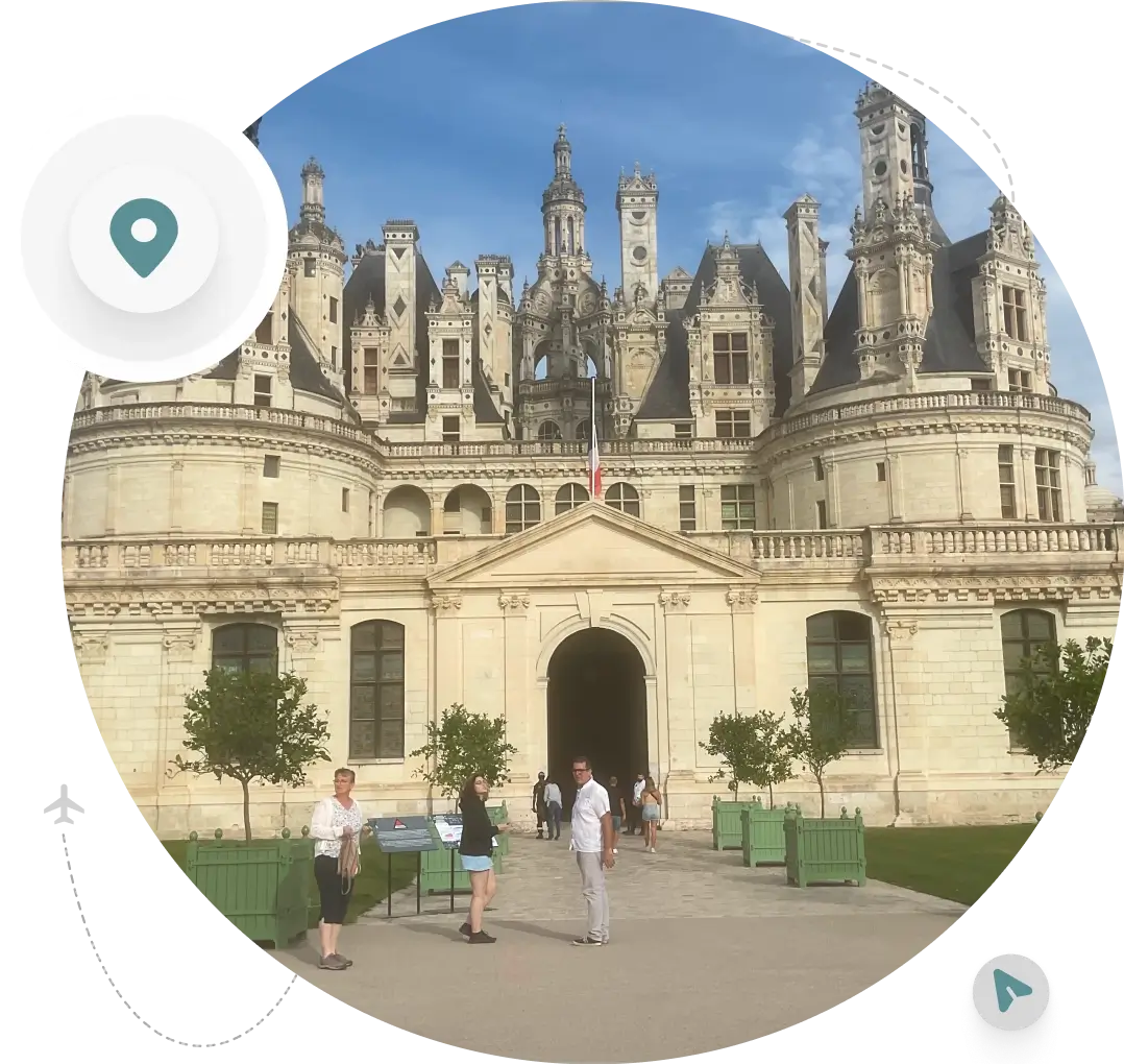 People visiting grand castle entrance